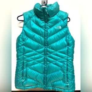 The North Face 550 Women’s size Large winter down vest. Teal